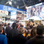 large crowd at trade show booth